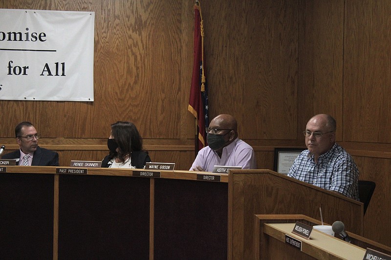 El Dorado School Board members are seen during a special-called meeting in August, where they voted 4-3 to impose a universal mask mandate on ESD campuses. The mask mandate was lifted last week, but an attorney representing several parents in a suit against the district said the case is still viable. (News-Times file)