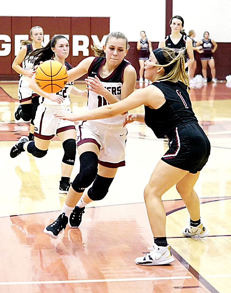 Westside Eagle Observer/RANDY MOLL
Gentry's Shelby Still dribbles around a Life Way defender, on her way to the basket, during the Nov. 16 game in Gentry between the two teams.
