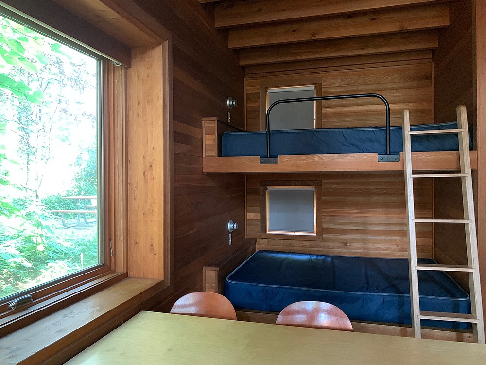 Large windows bring plenty of light into the Pine Forest camper cabins’ sleeping and dining areas. (Rachel Hutton/Minneapolis Star Tribune/TNS)