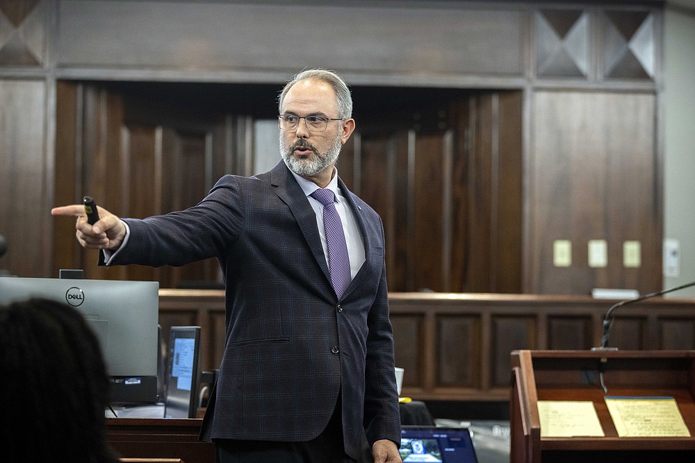 Defense attorney Jason B. Sheffield presents a closing argument to the jury during the trial of Travis McMichael, his father, Gregory McMichael, and William "Roddie" Bryan, at the Glynn County Courthouse, Monday, Nov. 22, 2021, in Brunswick, Ga. The three men charged with the February 2020 slaying of 25-year-old Ahmaud Arbery. (AP Photo/Stephen B. Morton, Pool)