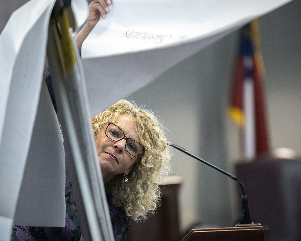 Greg McMichael's defense attorney Laura Hogue presents a closing argument to the jury during the trial of Travis McMichael, his father, Gregory McMichael, and William "Roddie" Bryan, at the Glynn County Courthouse, Monday, Nov. 22, 2021, in Brunswick, Ga. The three men are charged with the February 2020 slaying of 25-year-old Ahmaud Arbery. (AP Photo/Stephen B. Morton, Pool)