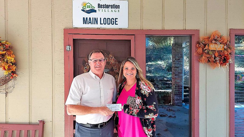 Moe Holm with Bella Vista Community Church Foundation presents Natalie Tibbs, executive director of Restoration Village, a check to cover the cost to renovate two residential bedrooms. The BVCC Foundation receives and invests living memorials and donations to support faith-based groups and community organizations. Restoration Village is a long-term shelter for women and children. Information: Moe Holm at (479) 531-5128 or Natalie Tibbs at (479) 631-7345.

(Courtesy photo)