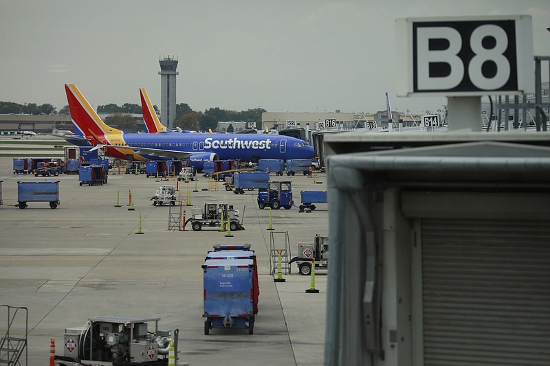 Southwest Airlines passenger jets are parked on the tarmac at Midway International Airport (MDW) in Chicago on Oct. 11, 2021. MUST CREDIT: Bloomberg photo by Luke Sharrett