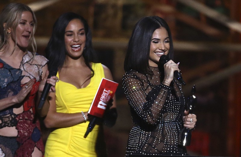 FILE - Mabel accepts the award for British Female Solo Artist on stage at the Brit Awards 2020 in London, Feb. 18, 2020. The organizers of the Brit Awards announced Monday Nov. 22, 2021, they are scrapping separate male and female artist categories in a shakeup designed to make the music prizes more inclusive. (Photo by Joel C Ryan/Invision/AP, File)
