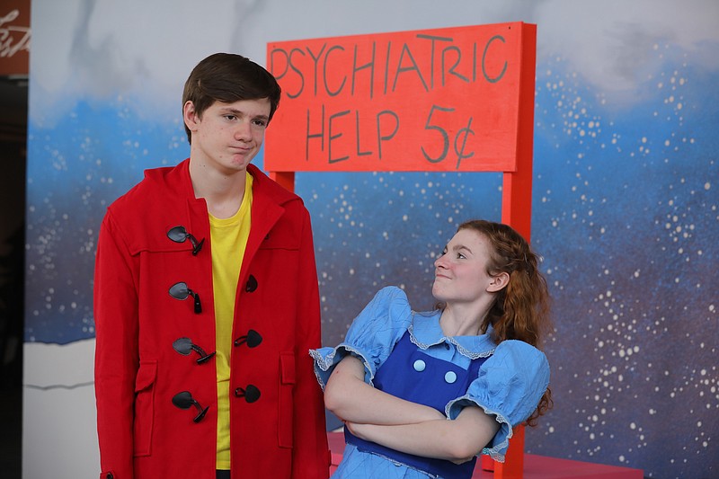 Long-suffering Charlie Brown (Simon Gless) seeks a nickel's worth of psychiatric help from Lucy (Madison Courage Fleck) in "A Charlie Brown Christmas." (Special to the Democrat-Gazette/Stephen Thornton)