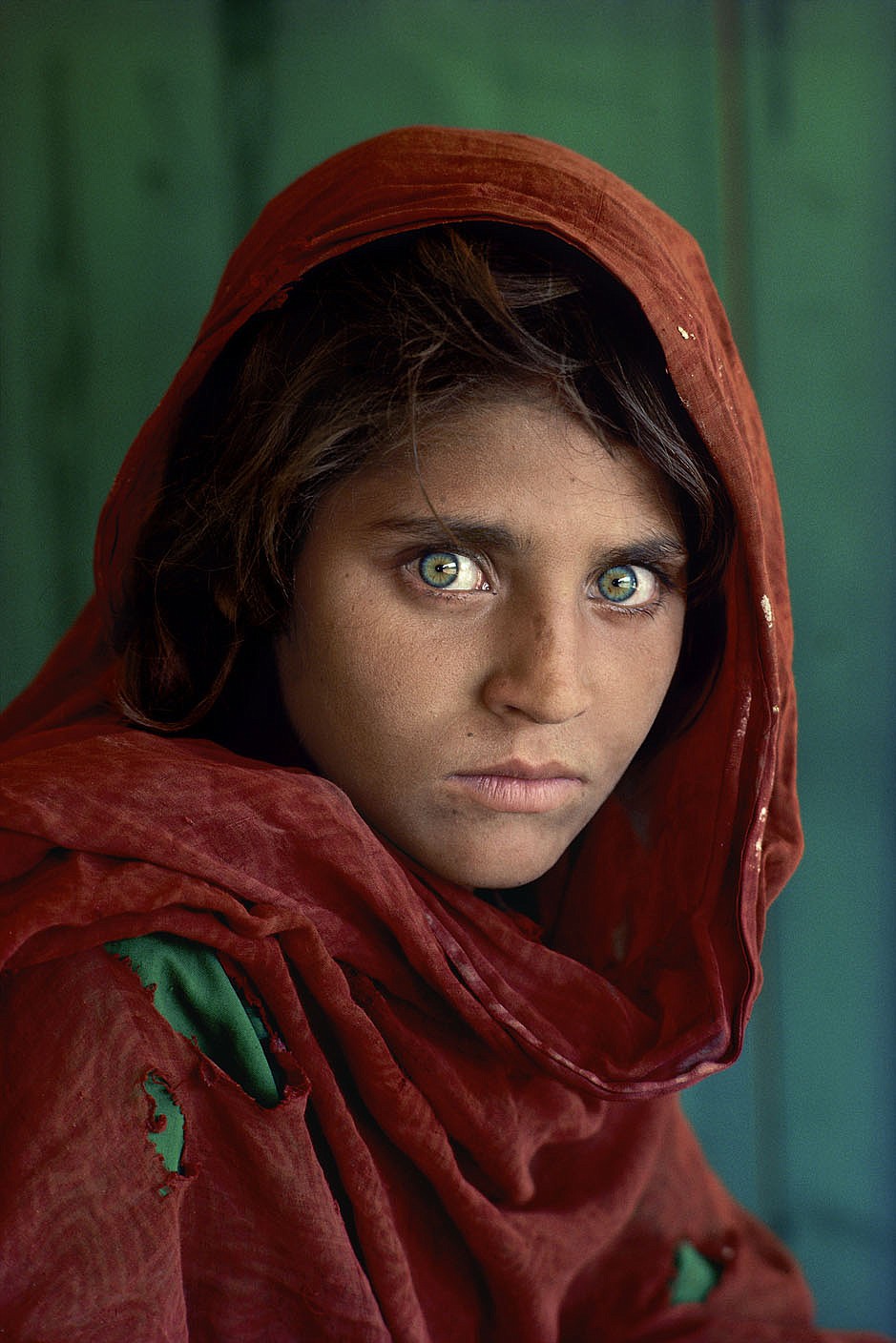 CAPTION: Sharbat Gula, Afghan Girl. Peshawar, Pakistan, 1984.
MAX PRINT SIZE: 40x60'
Sharbat Gula, at Nasir Bagh refugee camp near Peshawar, Pakistan, 1984
-Untold (pg. 81)
National Geographic Magazine, Vol. 167, No. 6, June 1985, Along Afghanistan's War-torn Frontier.
"The green-eyed Afghan girl became a symbol in the late twentieth century of strength in the face of hardship. Her tattered robe and dirt-smudged face have summoned compassion from around the world; and her beauty has been unforgettable. The clear, strong green of her eyes encouraged a bridge between her world and the West. And likely more than any other image, hers has served as an international emblem for the difficult era and a troubled nation." - Phaidon 55
The iconic image does not stand outside of time. Rather, it connects with the moment in a deeply profound way. Such as images are imbued with meaning, a significance that resonates deeply with a wide and diverse audience. McCurry's photograph of the Afghan girl is one such image. For many, this beautiful girl dressed in a ragged robe became a worldwide symbol for a nation in a state of collapse.
Haunted eyes tell of an Afghan refugee's fears.
--
Bannon, Anthony. (2005). Steve McCurry. New York: Phaidon Press Inc., 12.
NYC5958, NN11480593, MCS1985002 K035
Afghan Girl: Found
National Geographic, April 2002
Phaidon, Iconic Images, final book_iconic, page 33.
National Geographic Magazine, Along Afghanistan's War-torn Frontier, June 1985, Vol. 167, No. 6
Afghan girl, Pakistan, 1984 (Looking East, pg. 28)
South Southeast_Book
In the Shadow of Mountains_Book
Steve Mccurry_Book
Looking East_Book
Iconic_Book
Untold_book
PORTRAITS_APP
final print_MACRO
final print_Sao Paulo
final print_Milan
final print_Birmingham
Fine Art Print
final print_HERMITAGE
final print_Zurich
final print_Ankara, Michener, Utica
Graphic Novel_Book
Retouched_ Eli Durst, Sonny Fabbri 03/30/2015