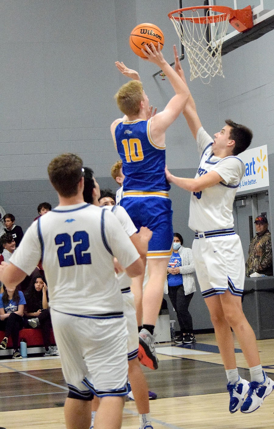 Westside Eagle Observer/MIKE ECKELS
Deegan Brooks (Bulldogs 10) goes for a one handed layup late in the third quarter of the Ozark Catholic-Decatur boys basketball contest in Rogers Nov. 22. Brooks hit the two pointer but it would not be enough to ward off a Warrior win 56-28 over the Bulldogs.