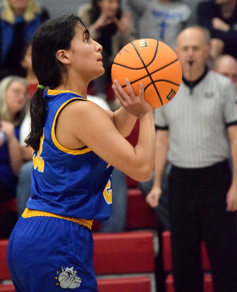 Westside Eagle Observer/MIKE ECKELS
Jazmine Herrera concentrates on the front of the rim as she prepares to launch a free throw at the basket during the fourth quarter of the Ozark Catholic-Decatur basketball contest in Rogers Nov. 22. Herrera missed the first shot but hit the second for a Lady Bulldog point.
