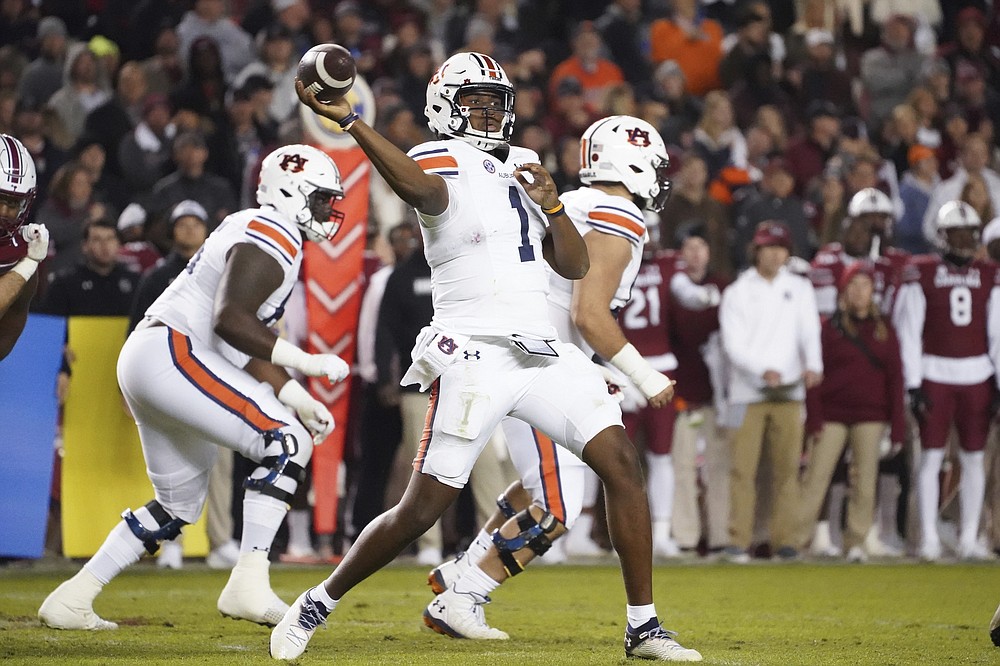 Auburn quarterback TJ Finley (1) throws a pass during the first half of the team's NCAA college football game against South Carolina on Saturday, Nov. 20, 2021, in Columbia, S.C. (AP Photo/Sean Rayford)