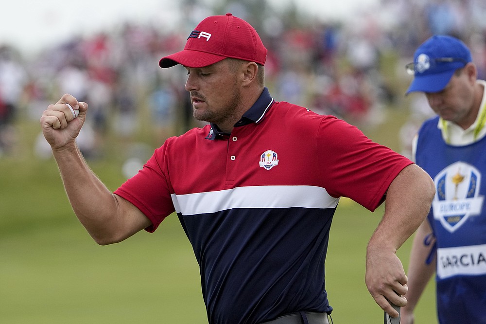FILE - Bryson DeChambeau reacts to his putt on the 11th hole during a Ryder Cup singles match at Whistling Straits Golf Course on Sept. 26, 2021, in Sheboygan, Wis. DeChambeau is playing an exhibition match against Brooks Koepka on Nov. 27 in Las Vegas. (AP Photo/Jeff Roberson, File)