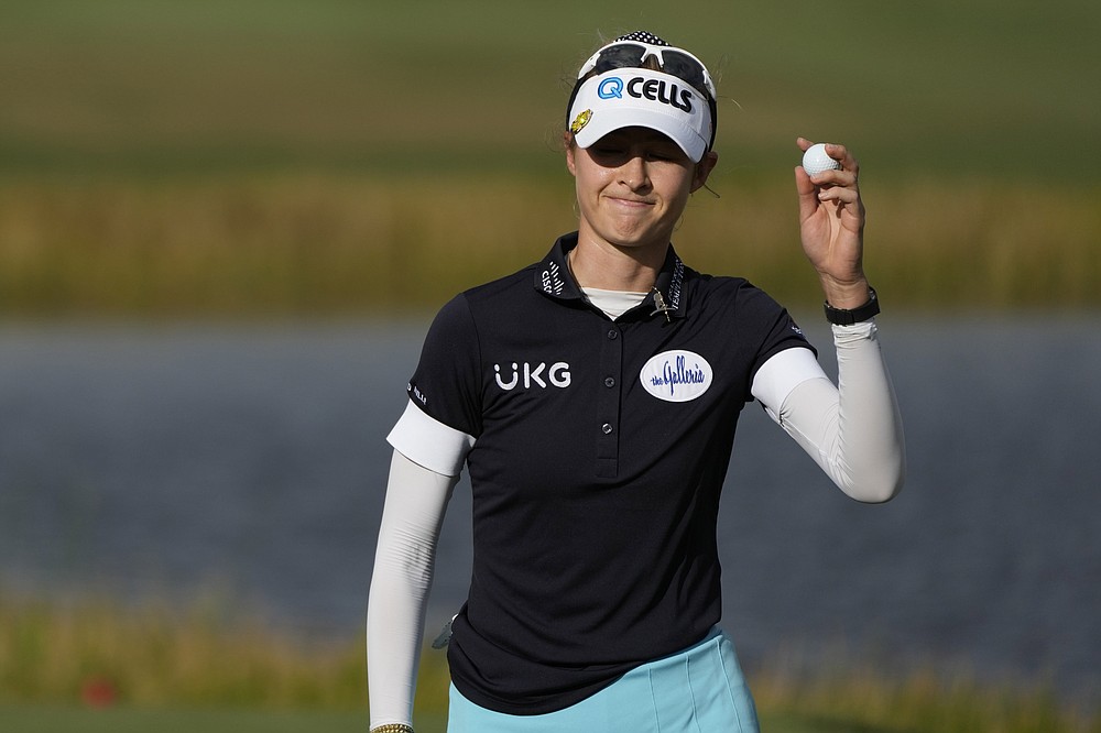 Nelly Korda tips her ball to the gallery on 18th green during the final round of the LPGA Tour Championship golf tournament, Sunday, Nov. 21, 2021, in Naples, Fla. (AP Photo/Rebecca Blackwell)