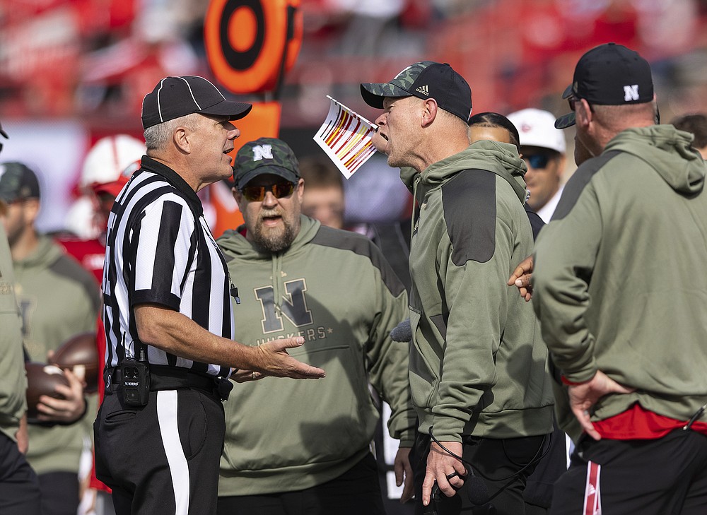 Nebraska head coach Scott Frost argues a call with linesman Bruce Keeling during the second half against Ohio State in an NCAA college football game Saturday, Nov. 6, 2021, at Memorial Stadium in Lincoln, Neb. Ohio State defeated Nebraska 26-17. (AP Photo/Rebecca S. Gratz)