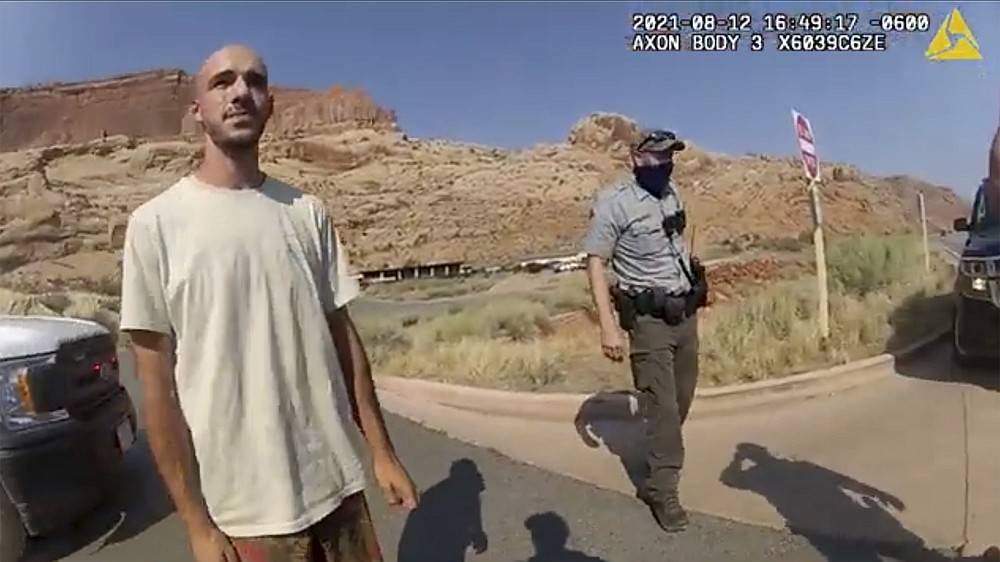 FILE - This Aug. 12, 2021 file photo from video provided by the Moab, Utah, Police Department shows Brian Laundrie talking to a police officer after police pulled over the van he was traveling in with his girlfriend, Gabrielle "Gabby" Petito, near the entrance to Arches National Park in Utah. An attorney for the family of Brian Laundrie said Tuesday, Nov. 23, 2021 that he fatally shot himself in the head. Laundrie had been the subject of a manhunt for more than a month as investigators searched for clues in the slaying of his girlfriend, Gabby Petito, during their cross-country van trip together. (The Moab Police Department via AP, File)