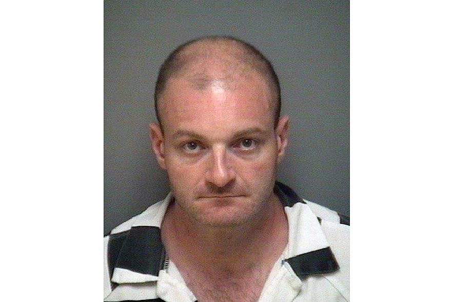 FILE - This undated photo provided by the Albemarle-Charlottesville Regional Jail shows Christopher Cantwell. A jury ordered white nationalist leaders and organizations to pay more than $25 million in damages Tuesday, Nov. 23, 2021, over violence that erupted during the deadly 2017 Unite the Right rally in Charlottesville. The lawsuit accused some of the country’s most well-known white nationalists of plotting the violence, including Jason Kessler, the rally’s main organizer; Richard Spencer, who coined the term “alt-right” to describe a loosely connected band of white nationalists, neo-Nazis and others; and Christopher Cantwell, a white supremacist who became known as the “crying Nazi” for posting a tearful video when a warrant was issued for his arrest on assault charges for using pepper spray against counterdemonstrators.(Albemarle-Charlottesville Regional Jail via AP)