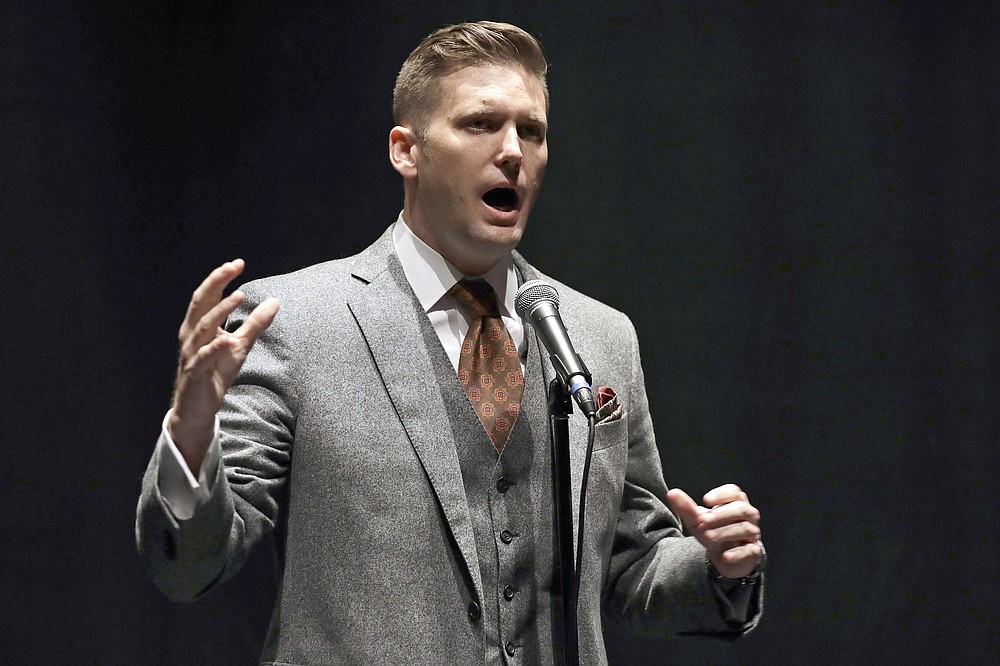 FILE - White nationalist Richard Spencer speaks at the University of Florida on Oct. 19, 2017 in Gainesville, Fla. A jury ordered white nationalist leaders and organizations to pay more than $25 million in damages Tuesday, Nov. 23, 2021, over violence that erupted during the deadly 2017 Unite the Right rally in Charlottesville. The lawsuit accused some of the country’s most well-known white nationalists of plotting the violence, including Jason Kessler, the rally’s main organizer; Richard Spencer, who coined the term “alt-right” to describe a loosely connected band of white nationalists, neo-Nazis and others; and Christopher Cantwell, a white supremacist who became known as the “crying Nazi” for posting a tearful video when a warrant was issued for his arrest on assault charges for using pepper spray against counterdemonstrators. (AP Photo/Chris O'Meara, File)