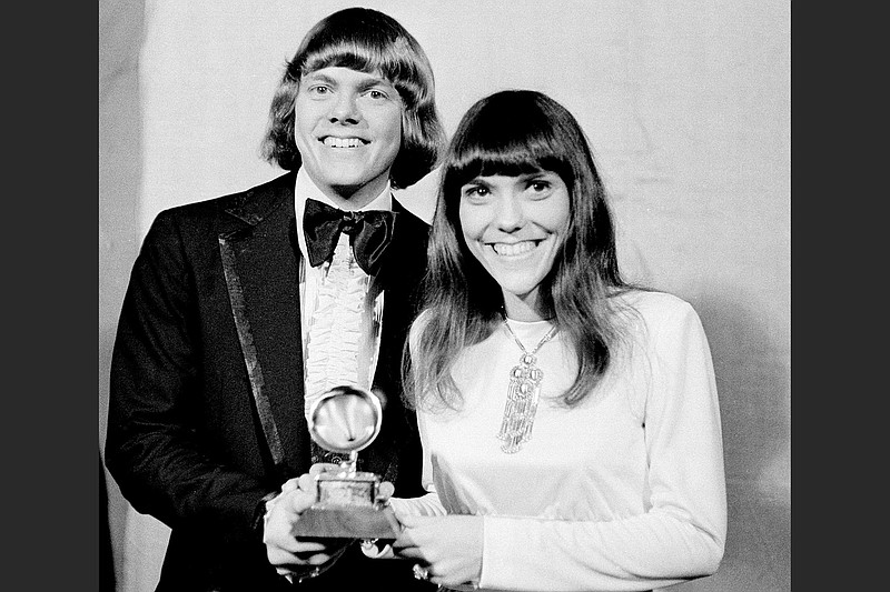 Richard and Karen Carpenter pose with their Grammy Award in Los Angeles March 17, 1971. A touring show of songs from their Christmas albums and TV specials will be onstage Monday at Little Rock's Ron Robinson Theater. (AP file photo)