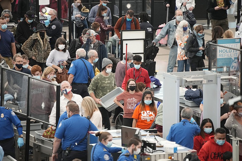 The Associated Press
Travelers queue up at the south security checkpoint as traffic increases with the approach of the Thanksgiving Day holiday on Tuesday at Denver International Airport in Denver.