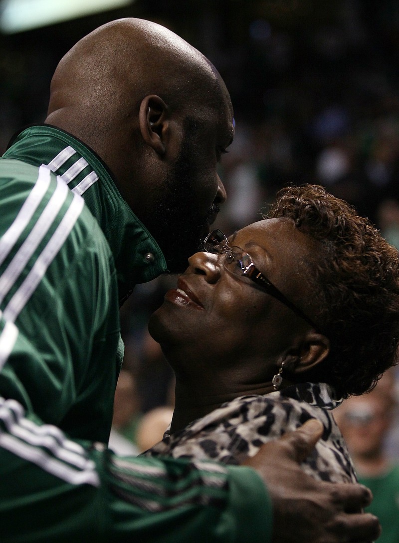 Shaquille O'Neal of the Boston Celtics hugs his mother, Lucille O'Neal, before a 2011 playoff game in Boston. (Elsa/Getty Images/TNS)