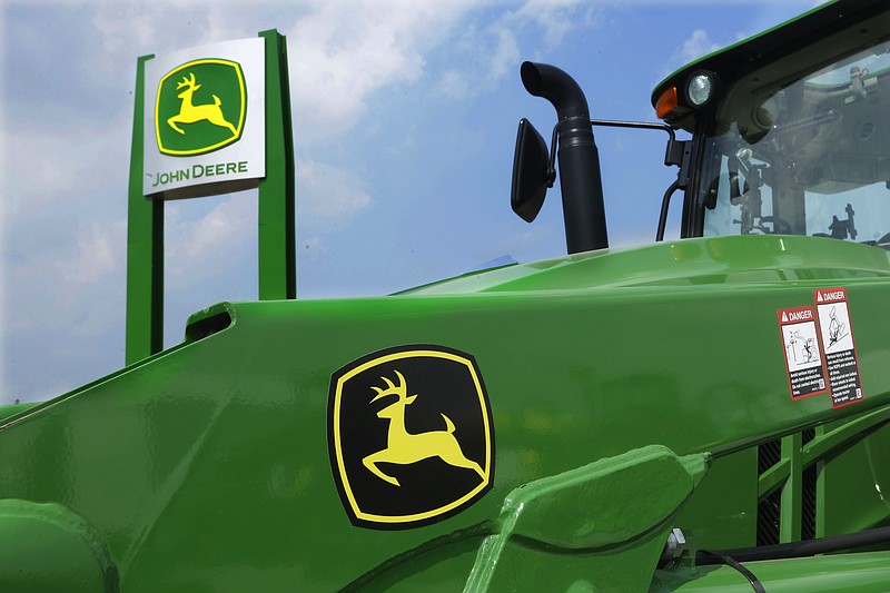 FILE-  John Deere equipment is on display at the Farm Progress Show on Aug. 31, 2015 in Decatur, Ill.  Deere &amp; Co. said on Wednesday, Nov. 24, 2021,  its fiscal fourth-quarter profit jumped 69% on strong sales of its agricultural and construction equipment despite a monthlong strike that began near the end of the period.   (AP Photo/Seth Perlman, File)