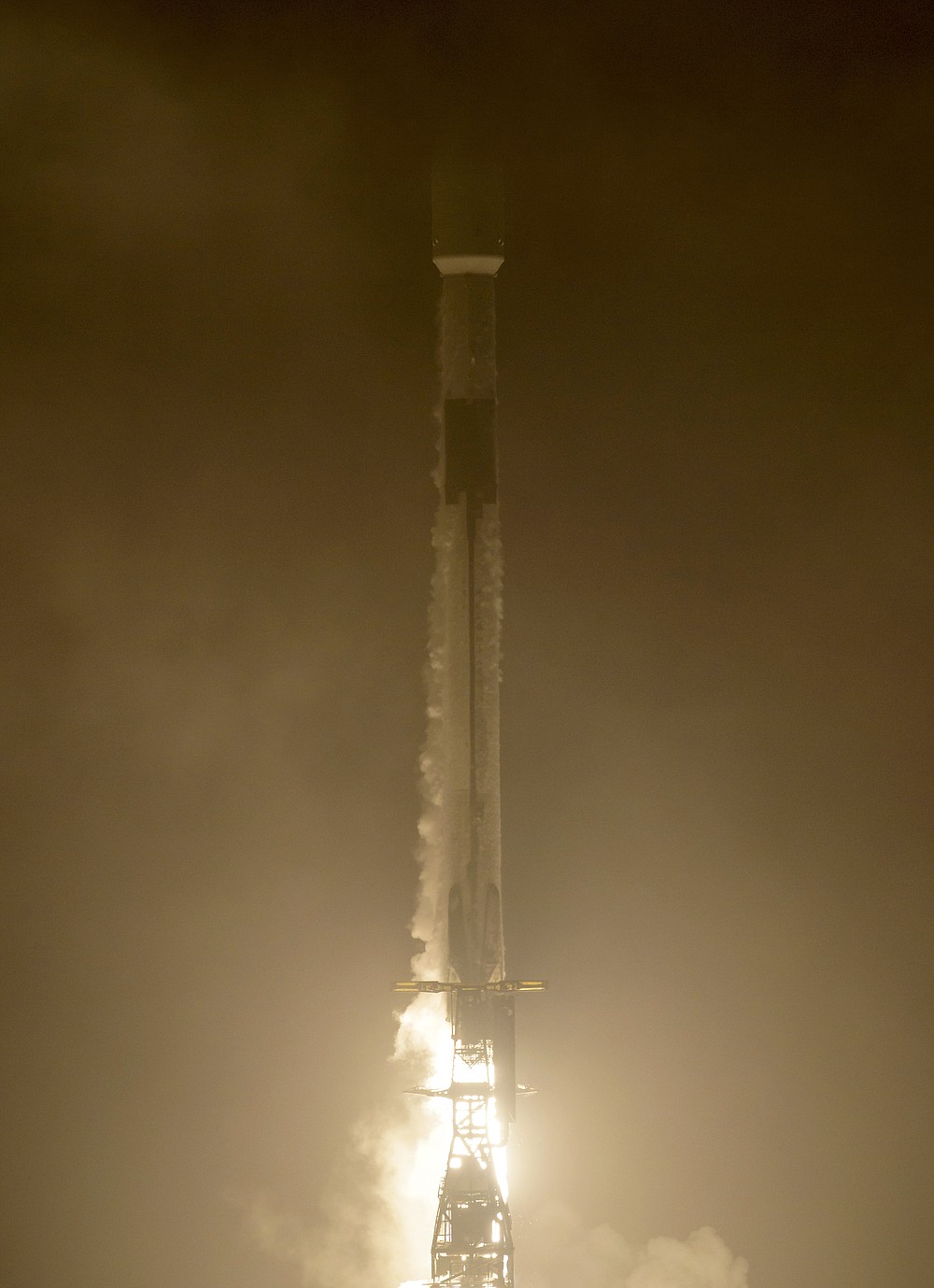 The SpaceX Falcon 9 rocket launches with the Double Asteroid Redirection Test, or DART, spacecraft onboard, Tuesday, Nov. 23, 2021, Pacific time (Nov. 24 Eastern time) from Space Launch Complex 4E, at Vandenberg Space Force Base in Calif. NASA launched the spacecraft on a mission to smash into an asteroid and test whether it would be possible to knock a speeding space rock off course if one were to threaten Earth. (Bill Ingalls/NASA via AP)