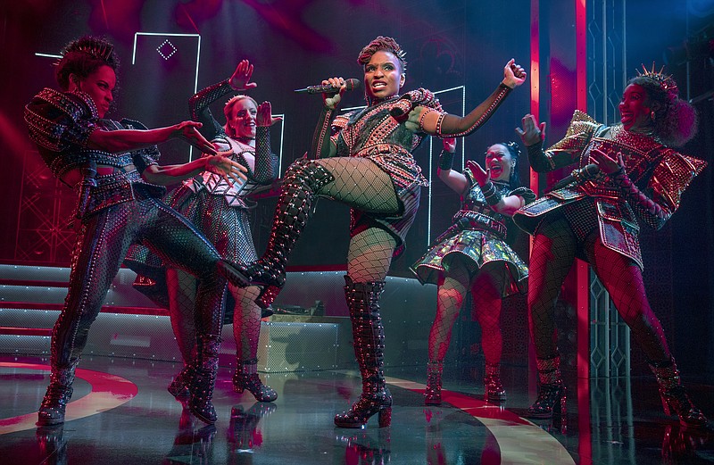 Brittney Mack portrays Anna of Cleves, center, during a performance of the musical &quot;Six,&quot; at Broadway&#x2019;s Brooks Atkinson Theatre in New York. Mack is slated to perform a mashup of some of its songs with her castmates and band in front of a televised audience of millions at the Macy&#x2019;s Thanksgiving Day Parade. (Joan Marcus/Boneau/Bryan-Brown via AP)
