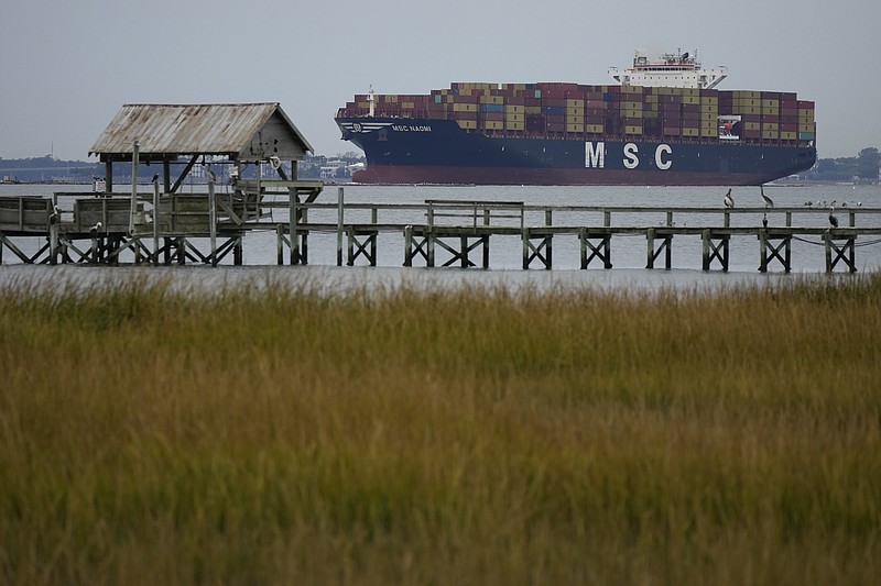 The MSC Naomi container ship sails out from from the port of Charleston, S.C.,Thursday, Oct. 28, 2021. Hampered by rising COVID-19 cases and persistent supply shortages, the U.S. economy slowed sharply to a 2% annual growth rate in the July-September period, the weakest quarterly expansion since the recovery from the pandemic recession began last year. (AP Photo/Rebecca Blackwell)
