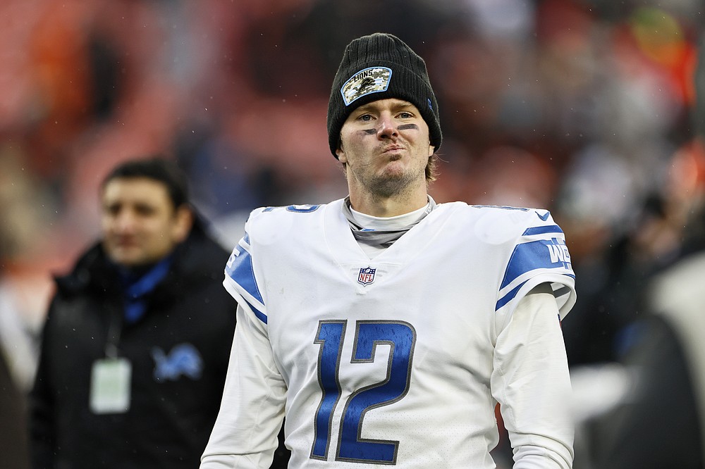 Detroit Lions quarterback Tim Boyle walks off the field after the Cleveland Browns won an NFL football game, Sunday, Nov. 21, 2021, in Cleveland. (AP Photo/Ron Schwane)