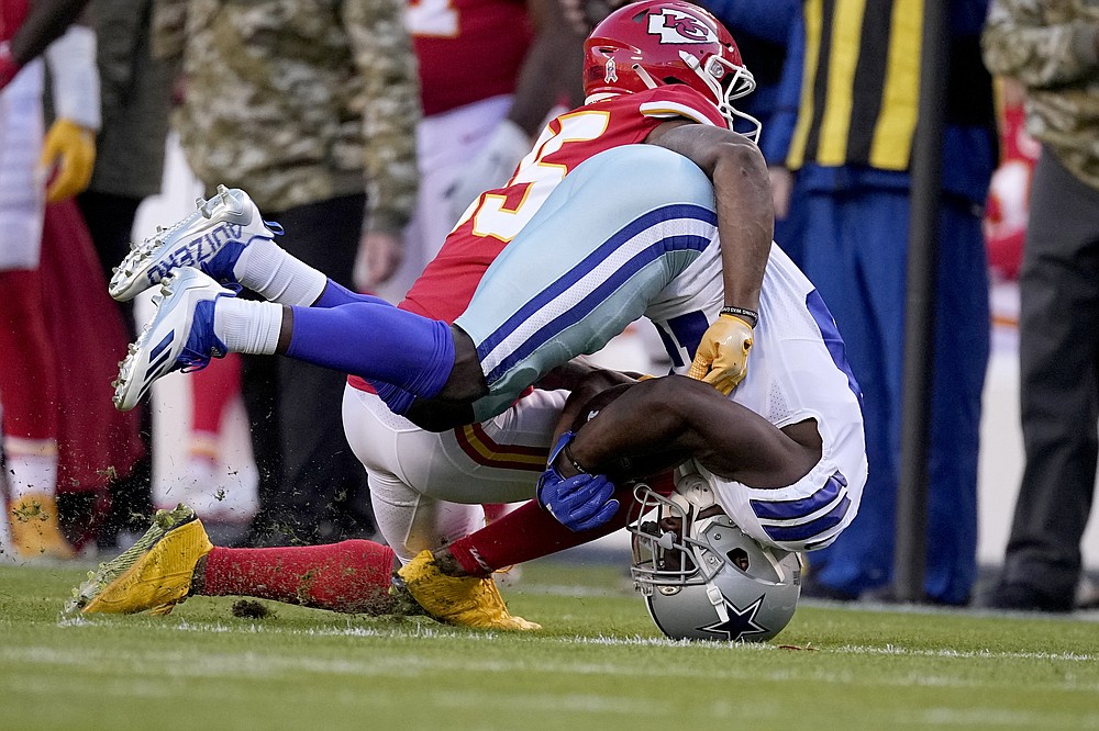 Dallas Cowboys wide receiver Michael Gallup, front, catches a pass as Kansas City Chiefs cornerback Charvarius Ward defends during the first half of an NFL football game Sunday, Nov. 21, 2021, in Kansas City, Mo. (AP Photo/Charlie Riedel)