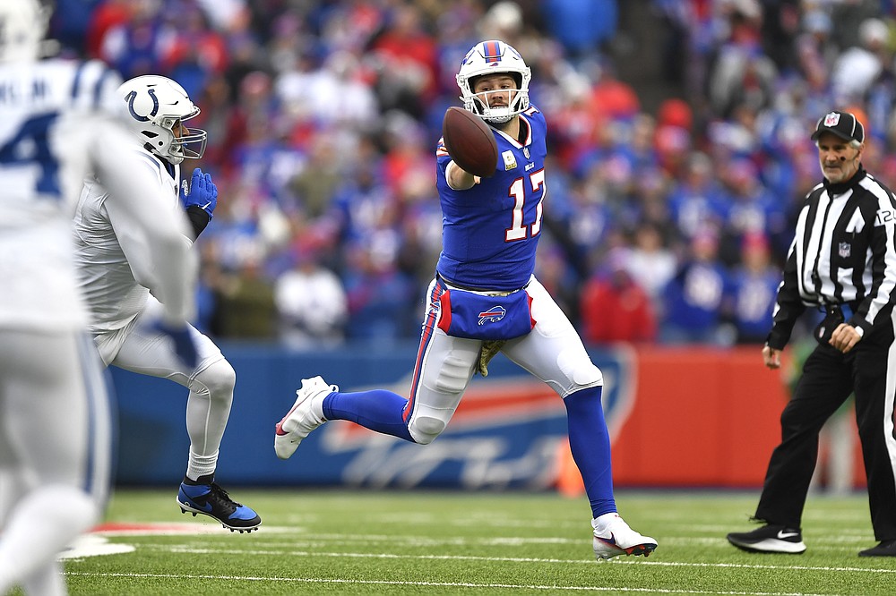 Buffalo Bills quarterback Josh Allen (17) gets off a shuffle pass during the first half of an NFL football game against the Indianapolis Colts in Orchard Park, N.Y., Sunday, Nov. 21, 2021. (AP Photo/Adrian Kraus)
