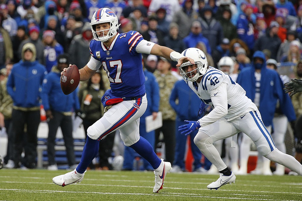 Buffalo Bills quarterback Josh Allen (17) scrambles with the ball during the first half of an NFL football game against the Indianapolis Colts in Orchard Park, N.Y., Sunday, Nov. 21, 2021. (AP Photo/Jeffrey T. Barnes)