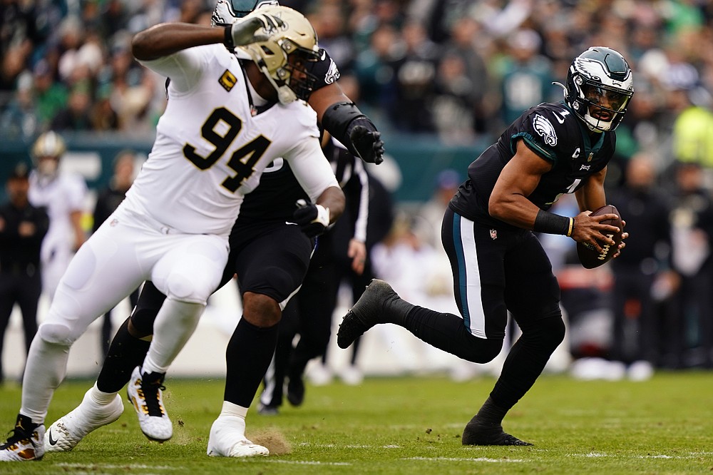 Philadelphia Eagles' Jalen Hurts scrambles during the first half of an NFL football game against the New Orleans Saints, Sunday, Nov. 21, 2021, in Philadelphia. (AP Photo/Derik Hamilton)