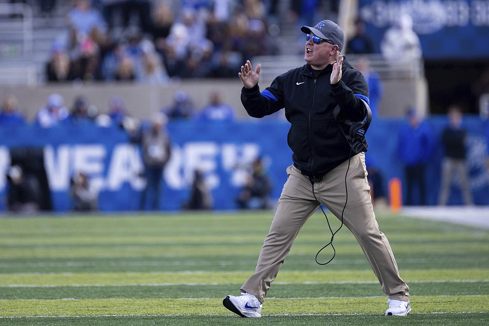 Kentucky coach Mark Stoops yells to players during the first half of an NCAA college football game against New Mexico State in Lexington, Ky., Saturday, Nov. 20, 2021. (AP Photo/Michael Clubb)