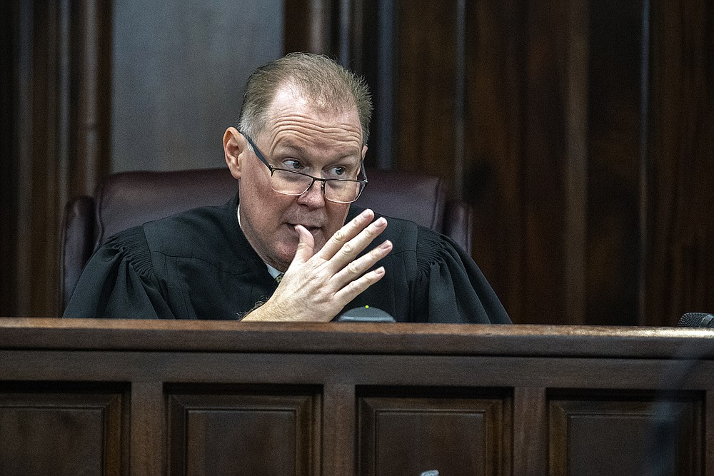 Superior Court Judge Timothy Walmsley clarifies a jury request to view a short video clip as part of their deliberation during the trial of Greg McMichael, his son Travis McMichael, and neighbor, William "Roddie" Bryan, Wednesday, Nov. 24, 2021, in the Glynn County Courthouse in Brunswick, Ga. The three are charged with the February 2020 slaying of 25-year-old Ahmaud Arbery. (AP Photo/Stephen B. Morton, Pool)