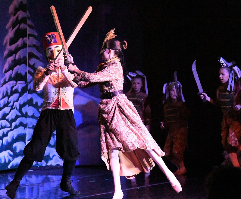 The Nutcracker, played by Konrad Rogers, 15, is engaged in a fight to the death with the Rat Queen, played by Anabel Flores, 13. - Photo by Tanner Newton of The Sentinel-Record