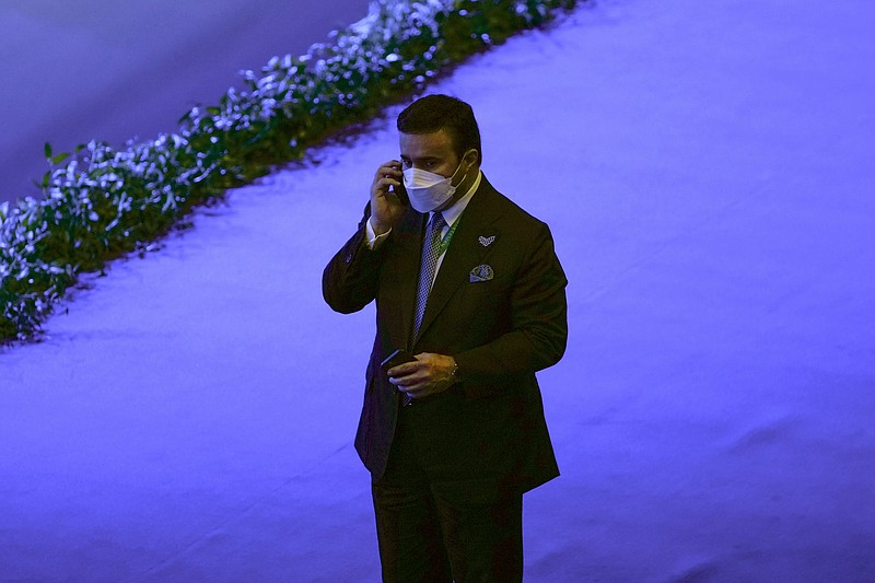 Inspector general at the United Arab Emirates interior ministry Maj. Gen. Ahmed Naser al-Raisi speaks on his cell phone during the first day of the Interpol annual assembly in Istanbul, Turkey, Tuesday, Nov. 23, 2021. Interpol is holding its General Assembly in Istanbul to discuss security threats and to hold a closely watched election for the international policing body's new leadership. (AP Photo/Francisco Seco)