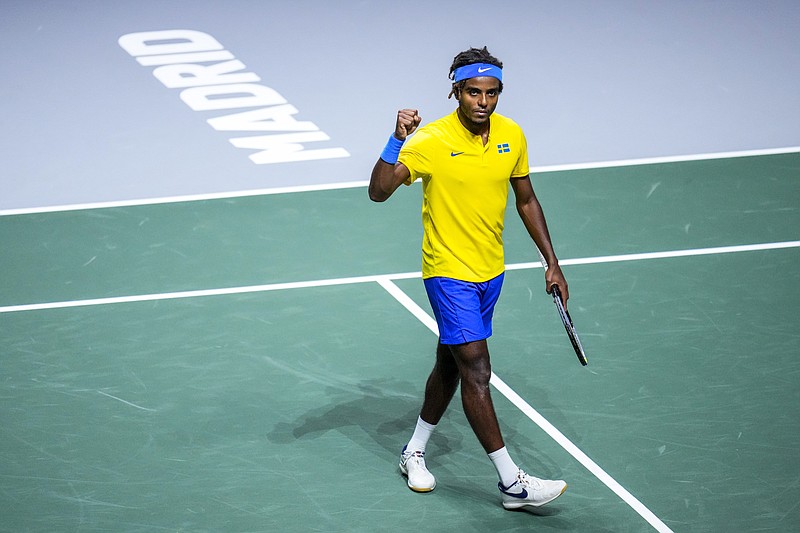 Sweden's Elias Ymer celebrates his victory over Canada's Steven Diez during their Davis Cup match in Madrid, Spain on Thursday. - Photo by Manu Fernandez of The Associated Press