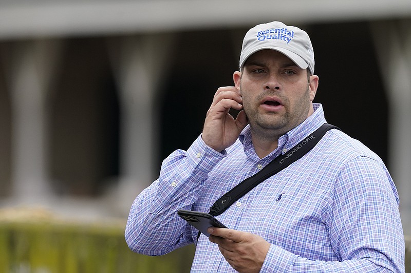 Trainer Brad Cox looks over his horses at Churchill Downs on April 29 in Louisville, Ky. The 41-year old Louisville native was named the winner of the Big Sport of Turfdom award this week. - Photo by Charlie Riedel of The Associated Press