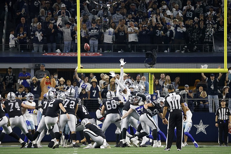 Fans look on as Las Vegas Raiders' Daniel Carlson (2) kicks a game-winning field goal in overtime against the Dallas Cowboys in Arlington, Texas on Thursday. - Photo by Ron Jenkins of The Associated Press