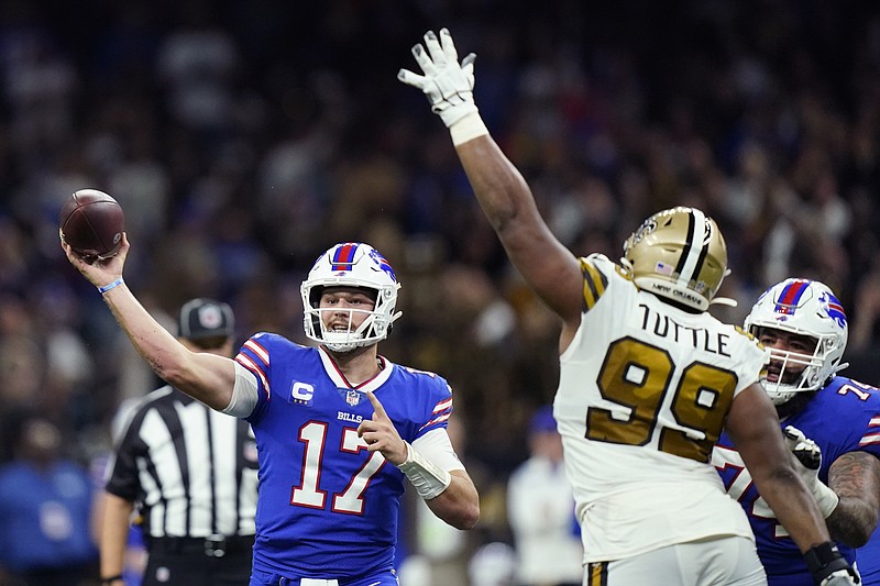 Buffalo Bills quarterback Josh Allen (17) passes under pressure from New Orleans Saints defensive tackle Shy Tuttle (99) in the second half of an NFL game in New Orleans Thursday. - Photo by Derick Hingle of The Associated Press