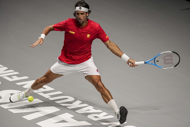 Spain's Feliciano Lopez returns a ball to Ecuador's Roberto Quiroz during their Davis Cup tennis match at the Madrid Arena stadium in Madrid, Spain, Friday, Nov. 26, 2021. (AP Photo/Bernat Armangue)