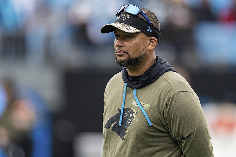 FILE - Carolina Panthers defensive run game coordinator Al Holcomb looks on during warmups before an NFL football game against the Washington Football Team Sunday, Nov. 21, 2021, in Charlotte, N.C. As an African American growing up in Queens, New York, Holcomb spent his fall Sundays watching Tom Landry and the Dallas Cowboys on television, and dreaming of one day becoming an NFL head coach. The 51-year-old Holcomb has spent more than a quarter-century chasing that dream — one that eludes him to this day. (AP Photo/Jacob Kupferman, File)