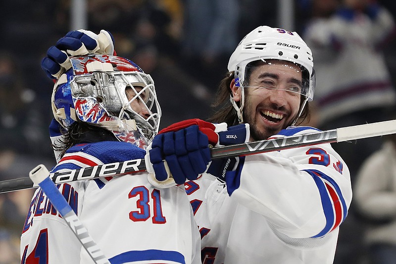 New York Rangers' Mika Zibanejad smiles as he congratulates goaltender Igor Shesterkin after their win over the Boston Bruins in an NHL game Friday in Boston. - Photo by Winslow Townson of The Associated Press