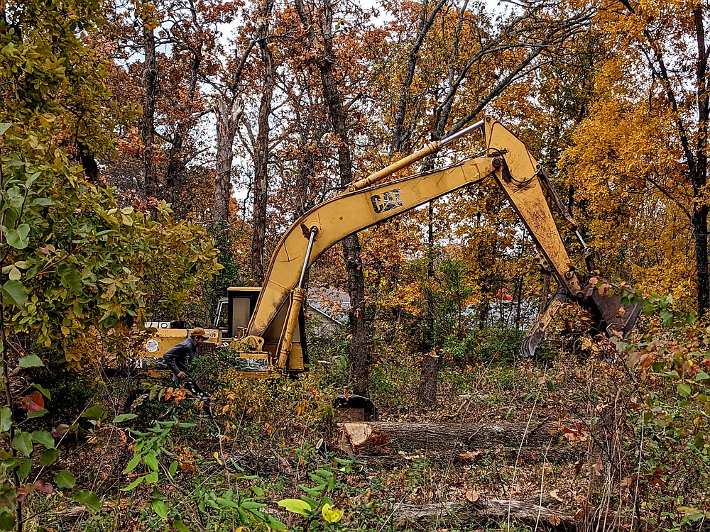 Westside Eagle Observer/RANDY MOLL
Making way for new housing, this excavator works in the Pioneer Woods Subdivision last month.
