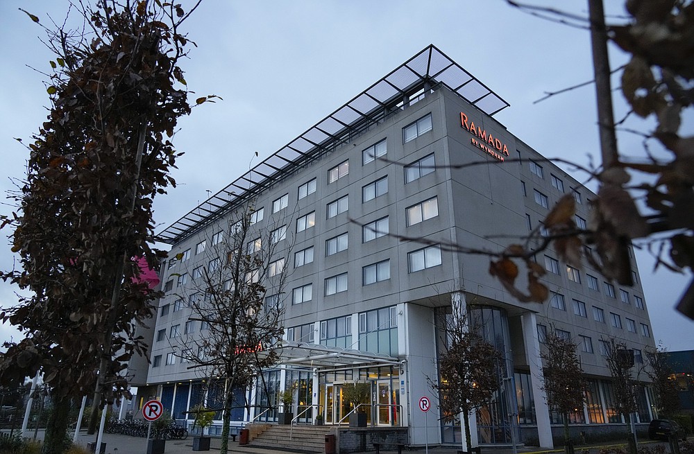 Exterior view of the hotel in Badhoevedorp near Schiphol Airport, Netherlands, where Dutch authorities have isolated 61 people who tested positive for COVID-19 on two arriving flights originating from South Africa, Saturday, Nov. 27, 2021. Authorities are carrying out further investigations to see if any of the travelers have the omicron variant. (AP Photo/Peter Dejong)