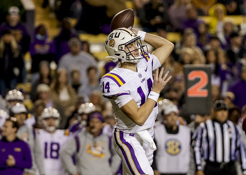 LSU quarterback Max Johnson (14) looks to throw a pass against Texas A&amp;M during the first quarter of an NCAA college football game in Baton Rouge, La., Saturday, Nov. 27, 2021. (AP Photo/Derick Hingle)