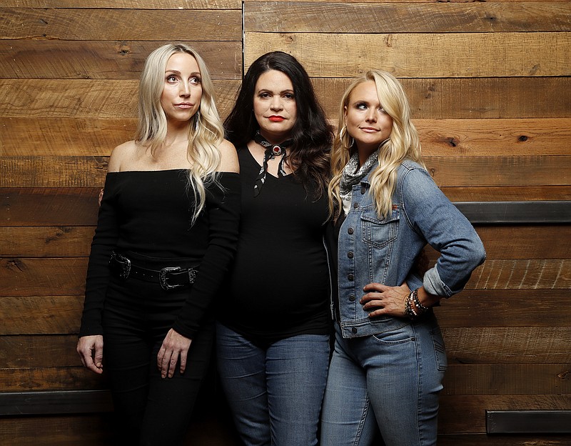 FILE - Ashley Monroe, from left, Angaleena Presley and Miranda Lambert of the Pistol Annies pose for a photo at Sony Nashville on Monday, Oct. 1, 2018 in Nashville, Tenn. The trio released a holiday album&#x201c;Hell of a Holiday.&#x201d;  (Photos by Donn Jones/Invision/AP, File)