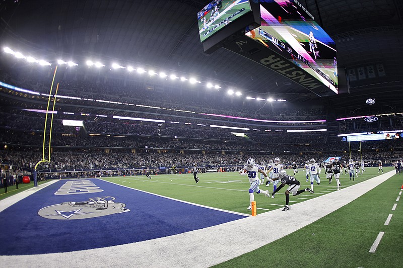 Dallas Cowboys running back Tony Pollard (20) gets past Las Vegas Raiders cornerback Brandon Facyson (35) as Pollard returns a kickoff for a touchdown in the second half of an NFL football game in Arlington, Texas, Thursday, Nov. 25, 2021. (AP Photo/Ron Jenkins)