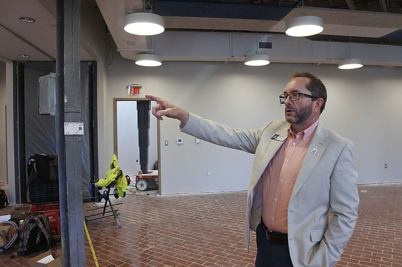 Kendall Ross, director of the Center for Business and Professional Development and Family Enterprise Center at the University of Arkansas at Fort Smith, talks about areas for classrooms on the first floor of the university's space at the Bakery District in downtown Fort Smith Monday. This space will serve as the new location for the university's Center for Business and Professional Development and Family Enterprise Center, as well as the Fort Smith regional office of the Arkansas Small Business and Technology Development Center.
(NWA Democrat-Gazette/Thomas Saccente)