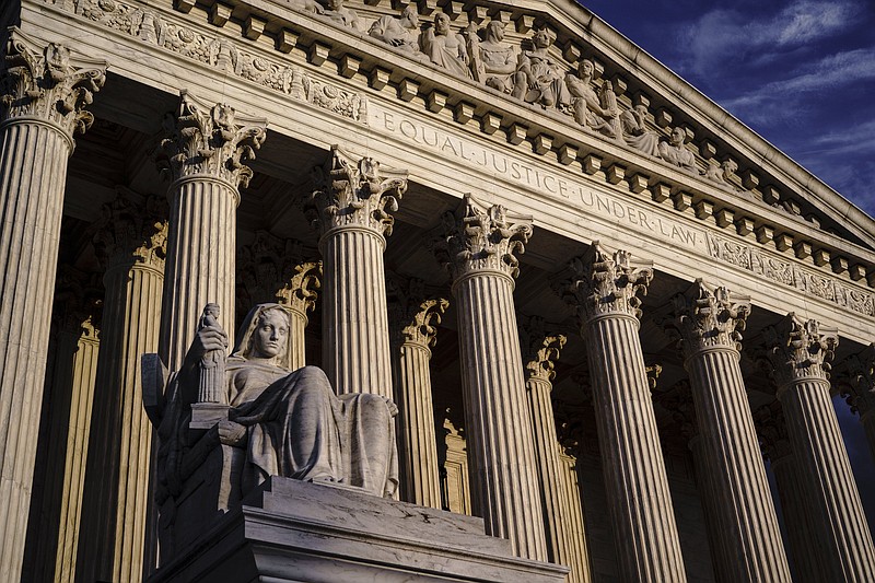 FILE - The Supreme Court is seen at dusk in Washington, Oct. 22, 2021. Both sides are telling the Supreme Court there?s no middle ground in Wednesday?s showdown over abortion. The justices can either reaffirm the constitutional right to an abortion or wipe it away altogether. (AP Photo/J. Scott Applewhite, File)