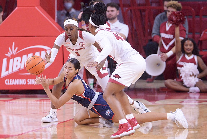 Arkansas' Marquesha Davis, left, and Makayla Daniels try to get the ball from Belmont's Kilyn McGuff Sunday at Bud Walton Arena in Fayetteville. - Photo by J.T. Wampler of NWA Democrat-Gazette